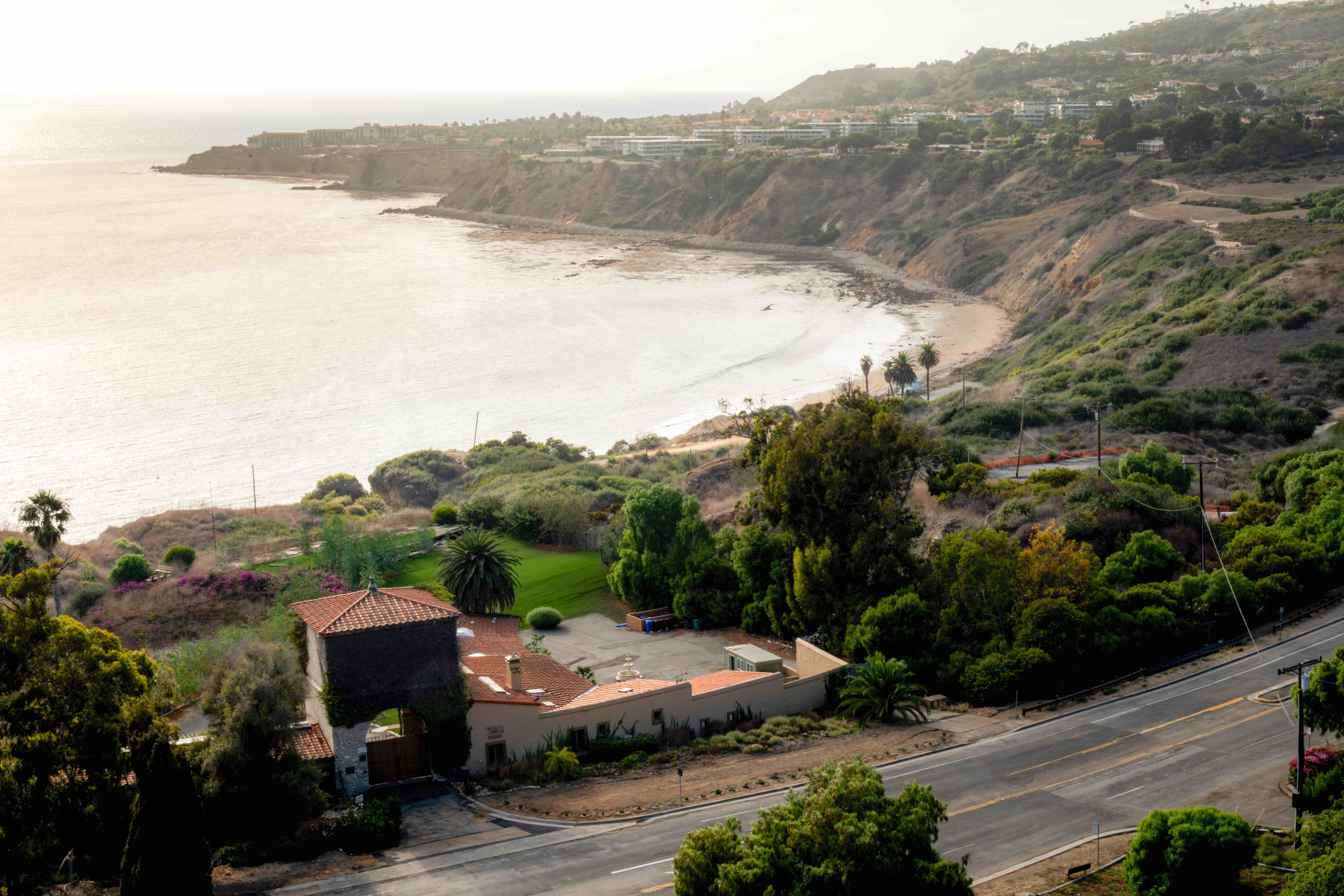 Aerial view of Palos Verdes coastline with curved beach and residential development